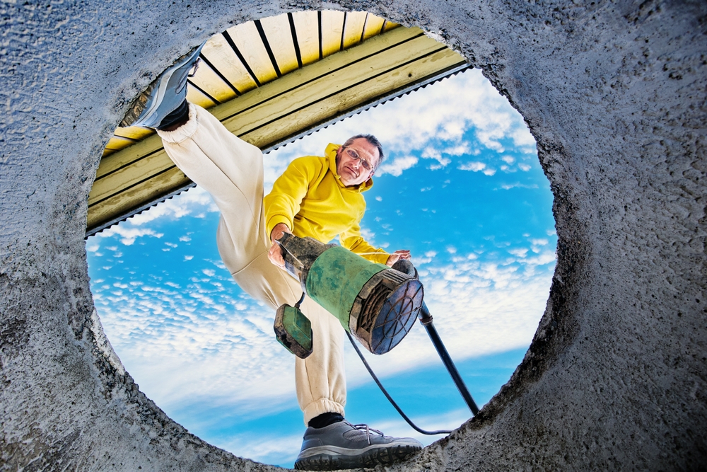 Homeowner,Installing,Submersible,Sewage,Pump,In,Sump,Pit,To,Pump
